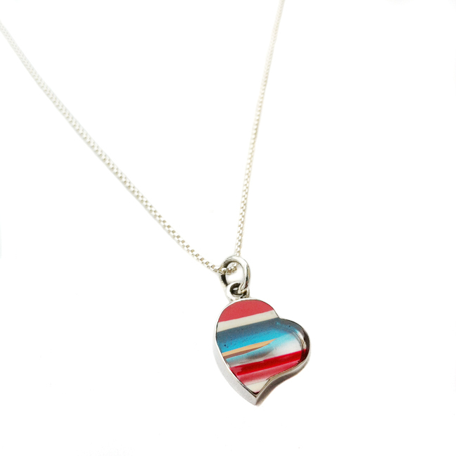 Upcycled surfboard resin charm necklace in sterling.