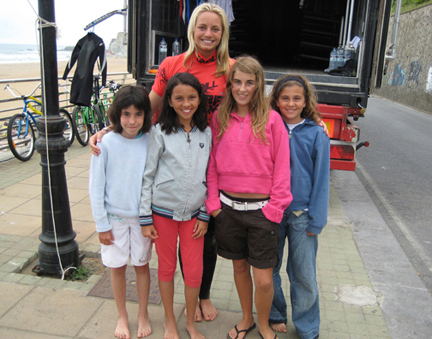 Hailey Partridge with some happy girl groms after a day of surf lessons