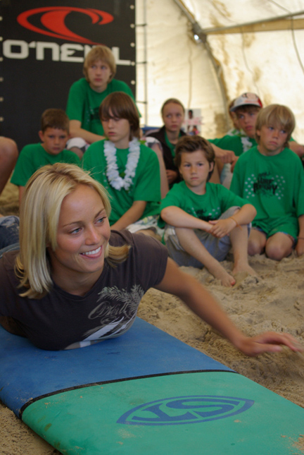 Sierra Partridge shows the kids how to paddle a board