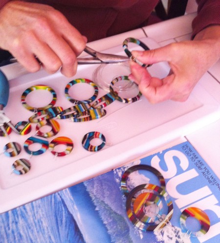 Donna wiring up the upcycled surfboard resin earrings